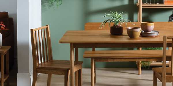 A Habitat nel wood 4 seater dining table in natural finish.